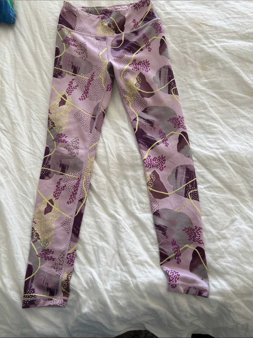 Athleta Lavender and Purple Abstract Print Leggings with Gold Accents